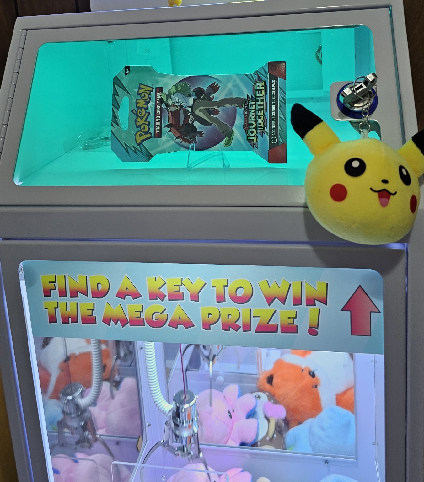 Close-up of the Mega Mini prize locker and plush toys in its claw chamber